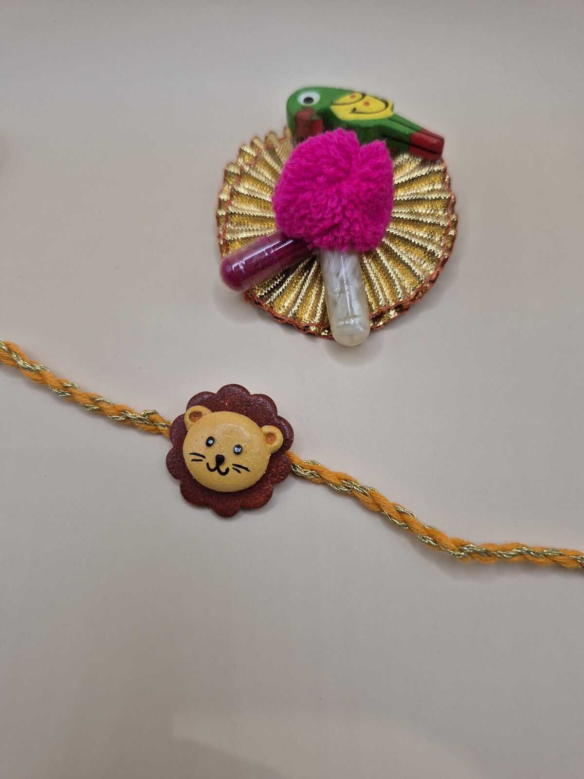 Kids Tie Bracelet / Cartoon Rakhi ( Lion , Tiger  ) clay handmade Rakhi