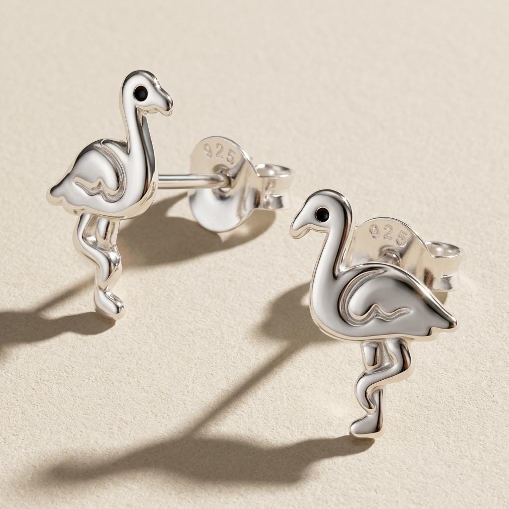 Close-up detail of swan or flamingo stud earrings