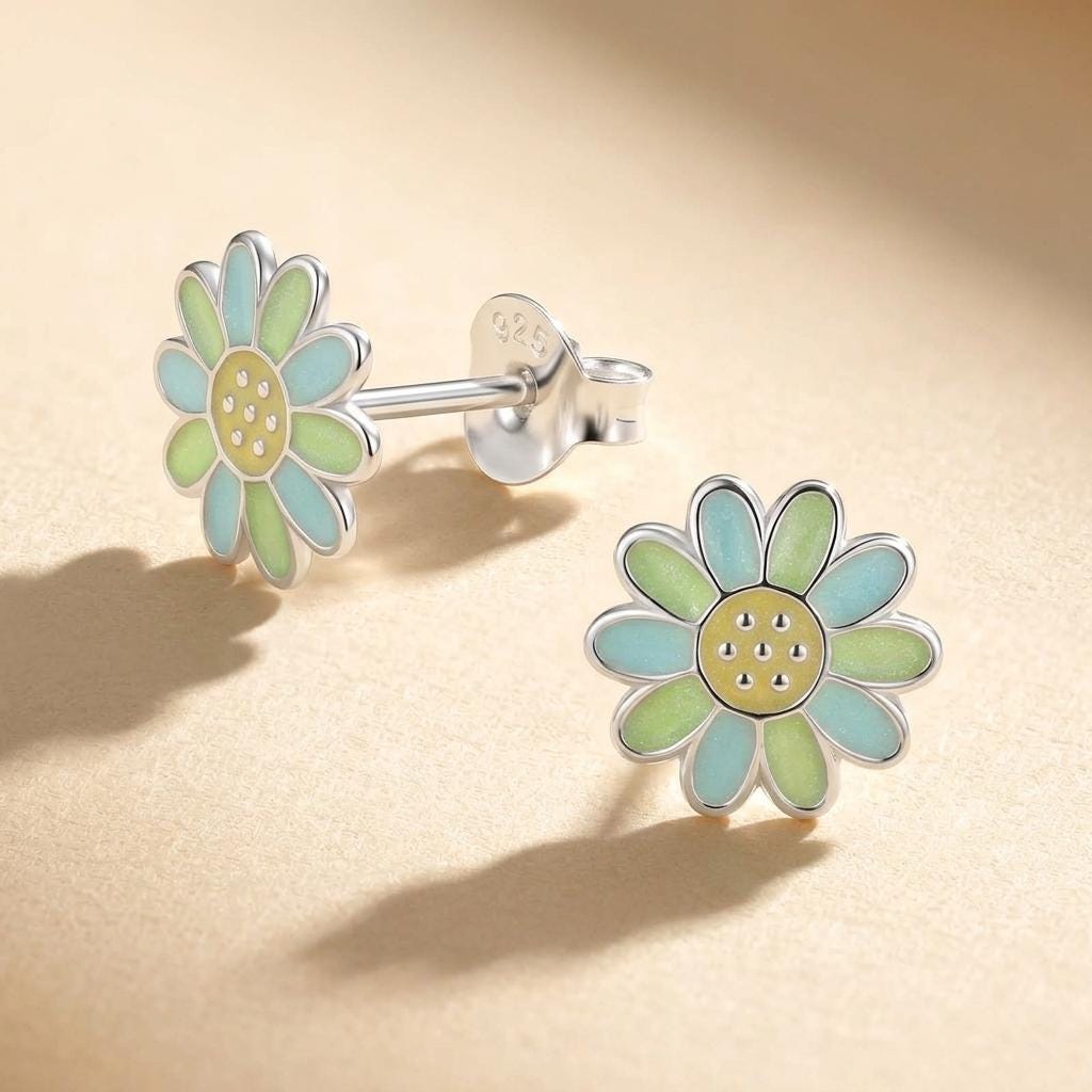 Close-up detail of pastel daisy stud earrings